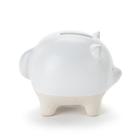 A white ceramic piggy bank with the face and tail of a fox. The feet of the bank are cream and textured.