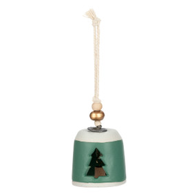 A mini green and white bell with a tree shaped cutout on the front. There are beads and a metal token at the top of the bell.