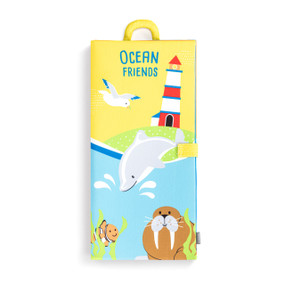 A sensory playmat with an ocean friends theme displayed folded and showing the handle at the top.