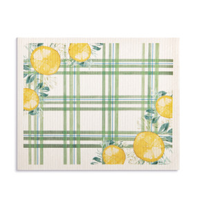 An oversized green and white plaid biodegradable dish cloth with illustrated lemons on the corners.