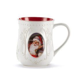 A white ceramic mug with a red interior and an image of a traditional Santa on the front.