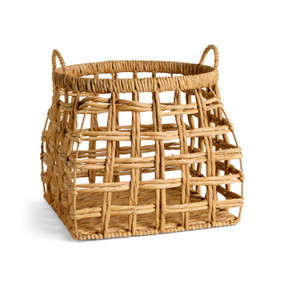 A large open weave brown basket with handles on the top sides.