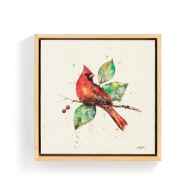 A square wall art in a light wood frame of a watercolor red cardinal sitting on a branch.