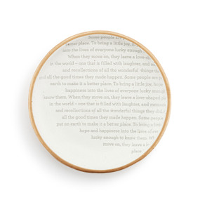 A small white round ceramic trinket dish with a gold rim and a repeated saying about remembrance.