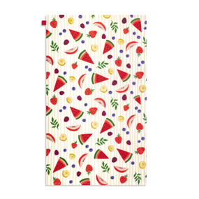 A white kitchen towel with colorful illustrations of fruit commonly used in smoothies.