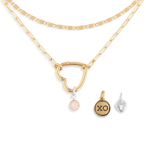A gold chain necklace with an open heart that is used to place other charms on.