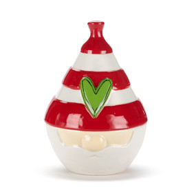 A red and white ceramic candy dish shaped like the hat and face of a gnome. The hat is the lid and has a raised green heart on it.