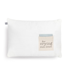 A white rectangular pillow with a cream fabric pocket on the front with the saying "for crying out loud". The pocket has a light blue fabric folded in it.