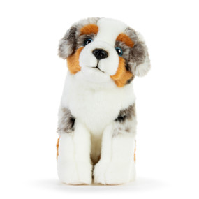 A white, gray and tan plush Australian Shepherd sitting down.