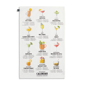 A white fabric towel with colorful illustrations and instructions for "Monthly Cocktails".
