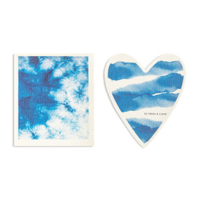 Two blue and white biodegradable dish cloths. One is heart shaped with a tie dye pattern and the saying "so fresh & clean" and the other is also blue and white tie dye pattern.