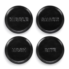 A set of four black ceramic appetizer plates. Each plate has a different word: "Nibble", "Snack", "Nosh" or "Bite".