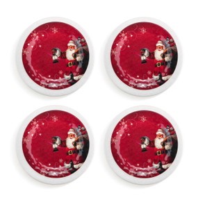 A set of four red and white melamine appetizer plates with an old fashioned Santa carrying a bag of toys and a lantern.