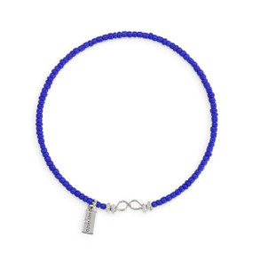 A round bracelet made of small blue beads.