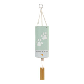 A mint green and white tubular ceramic wind chime with a wood chime and two paw prints. The chime says "pawprints on my heart".