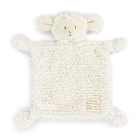 A fuzzy cream blankie with the face and ears of a lamb and a fabric patch in the corner that says "Little One, You are wrapped in love, prayers and blessings".