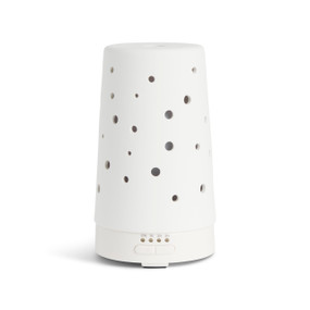 A white ceramic diffuser with holes in the side and a power button on the bottom front.