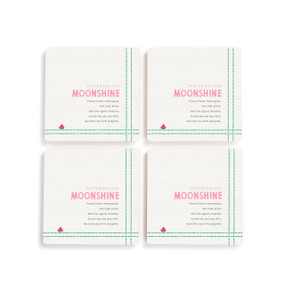 A set of four white square coasters with a basic recipe for a Watermelon Moonshine written in pink.