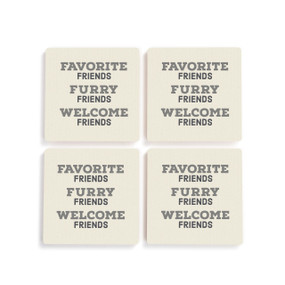 A set of four white ceramic coasters with the saying "Favorite Friends Furry Friends Welcome Friends"