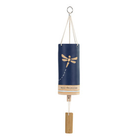 A navy blue tubular ceramic wind chime with a wood chime and a dragonfly on the front. The chime says "enjoy the journey".