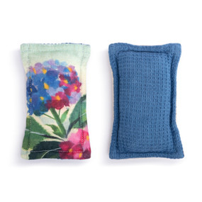 A set of two fabric kitchen sponges. One has a pink and blue hydrangea flower and the other is blue.