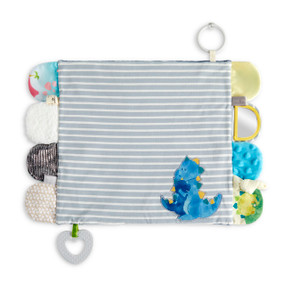 A gray and cream striped fabric blankie in a dinosaur theme with tabs on each end in different fabrics and textures. The blankie also has a teether and stroller ring attached.