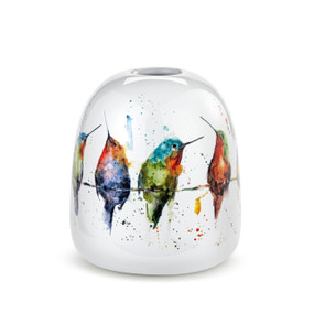 A white ceramic bud vase with colorful watercolor hummingbirds sitting on a wire all around the vase.