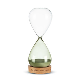 A glass sand timer with green glass on the bottom half sitting in a wood base that reads "my time with mom".