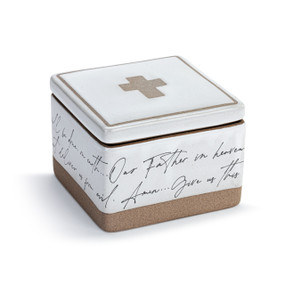 A white square ceramic keepsake box with a lid. The lid has a cross and the box has a prayer in script around the outside, displayed angled to the right.