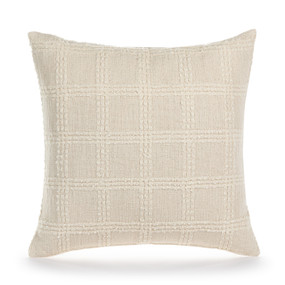 A square cream pillow with a cream textured checkered pattern on it.
