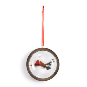 A hanging glass dome ornament on a wood base. The inside has a pebble image of two redbirds on a branch.