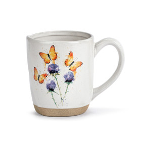 A white ceramic mug with a tan textured base. The mug has a watercolor image of orange butterflies and purple flowers.