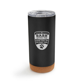 A black cork bottom tumbler with the saying "Bark national park. Chase your tail on every trail"