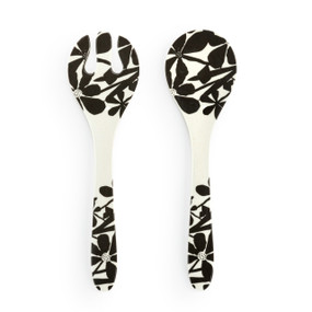 A large white plastic set of two serving utensils with a black bold floral pattern.