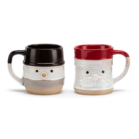 A pair of cream ceramic cuddle mugs, one that looks like Santa with a red interior and the other looks like a snowman with a black top and interior.