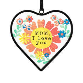 A small heart shaped sun catcher with a colorful floral illustration and the saying "Mom, I love you".
