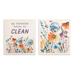 Two white biodegradable dish cloths, each with a wildflower pattern and one says "my favorite color is clean".