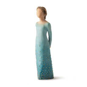 Front/left view: Lighter-skin figure, arms clasped behind back, hair and deep blue ombré garment dotted with gold leaf