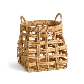 A small open weave brown basket with handles on the top sides.