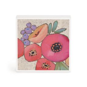 A small white box artwork of pink flowers.