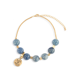 An adjustable gold chain bracelet with 7 blue and gold beads. There is a round gold charm that says "Believe Achieve" that can move between the seven beads.