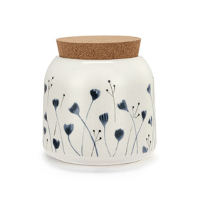 A small sized white ceramic container with a cork lid. The container has illustrated blue flowers.
