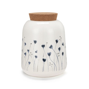 A medium sized white ceramic container with a cork lid. The container has illustrated blue flowers.