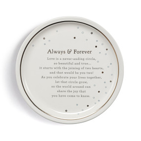 A round cream stoneware plate with a gold rim accent and blue and gray dots around the outside. The plate says "Always & Forever" and has a special message for newlyweds.
