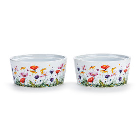 Two white ceramic ramekins with a watercolor image of colorful wildflowers, displayed at a slight angle to show the inner rim for stacking.
