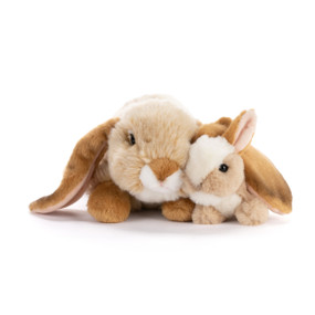 An adult plush bunny laying next to a baby plush bunny.