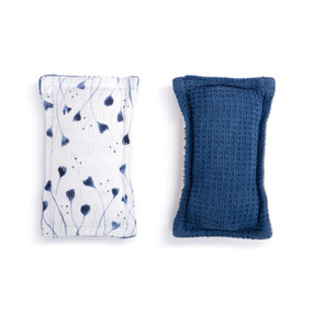 A set of two fabric kitchen sponges. On has small blue flowers on a white background and the other is blue.