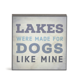 A small square gray wall art with the saying "Lakes were made for dogs like mine".