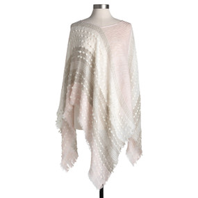 A blush pink, cream and tan textured and fringed light weight poncho displayed on a mannequin.