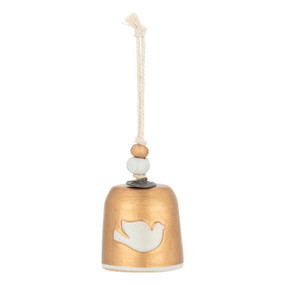 A mini gold bell with a white dove on the front. There are beads and a metal token at the top of the bell.
